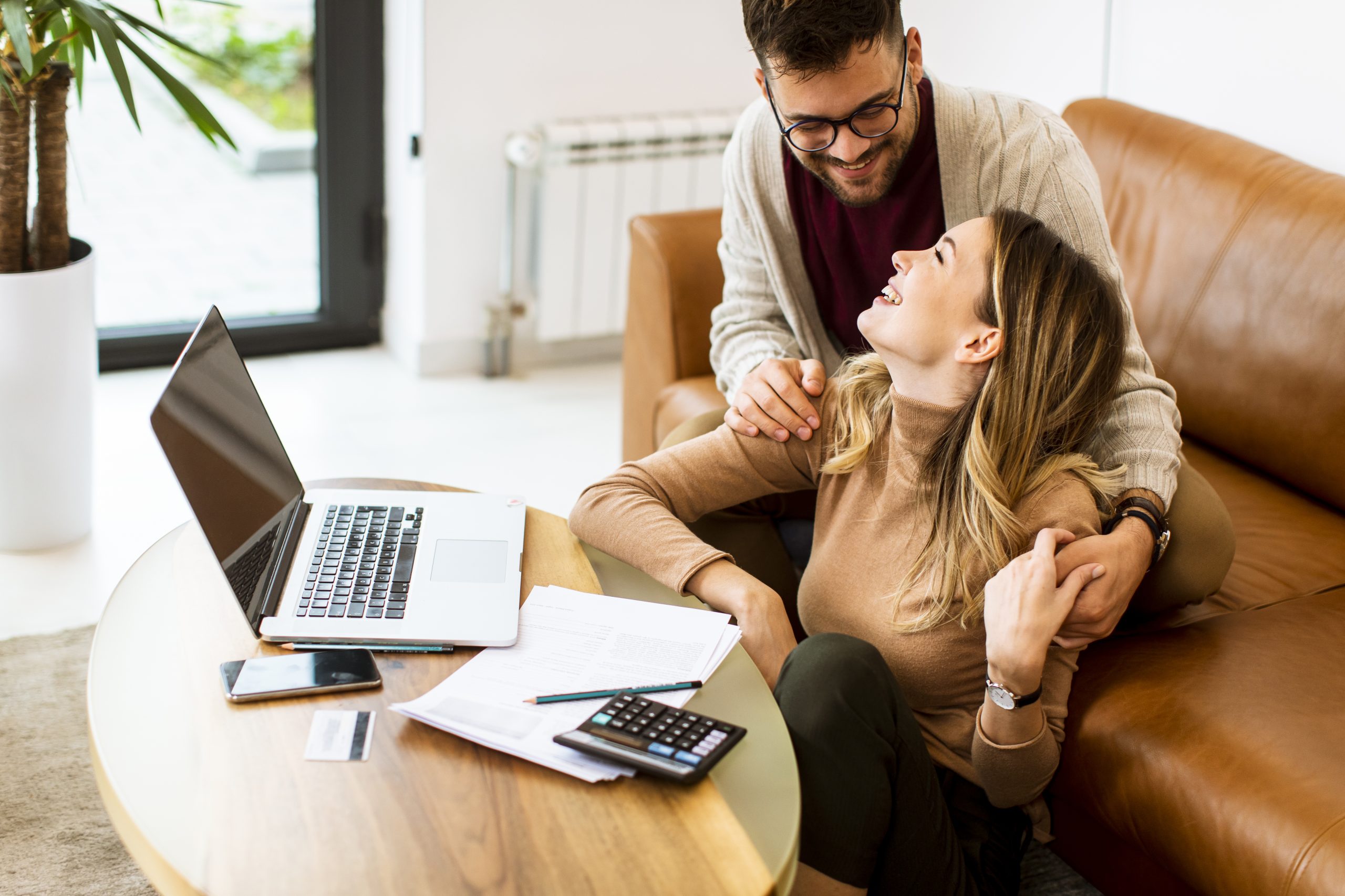 young couple using laptop together while sitting o 2025 02 21 11 48 22 utc scaled
